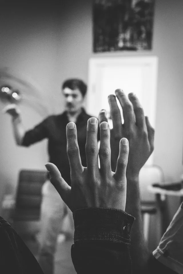Raised hands during a lecture