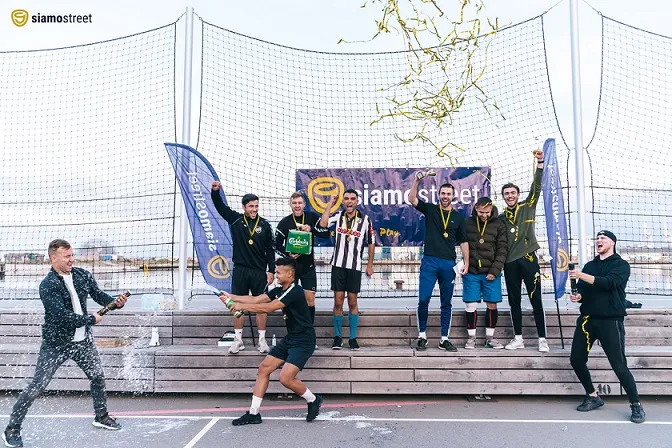 Football players on podium winning the siamo street cup